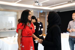 Ritu Bhasin speaking with a Muslim woman