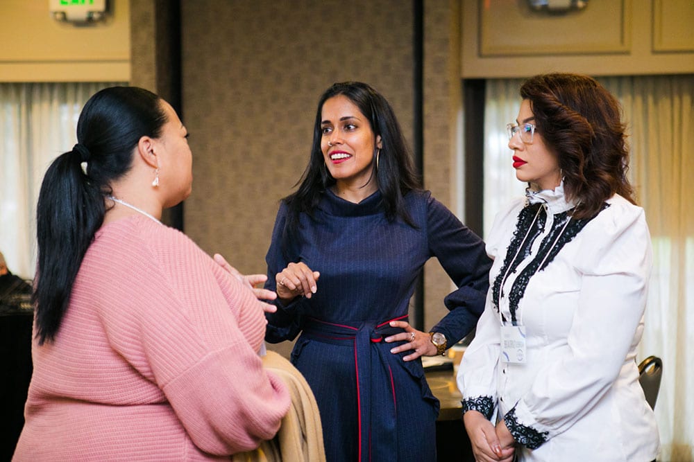 Ritu Bhasin speaking with two women about allyship