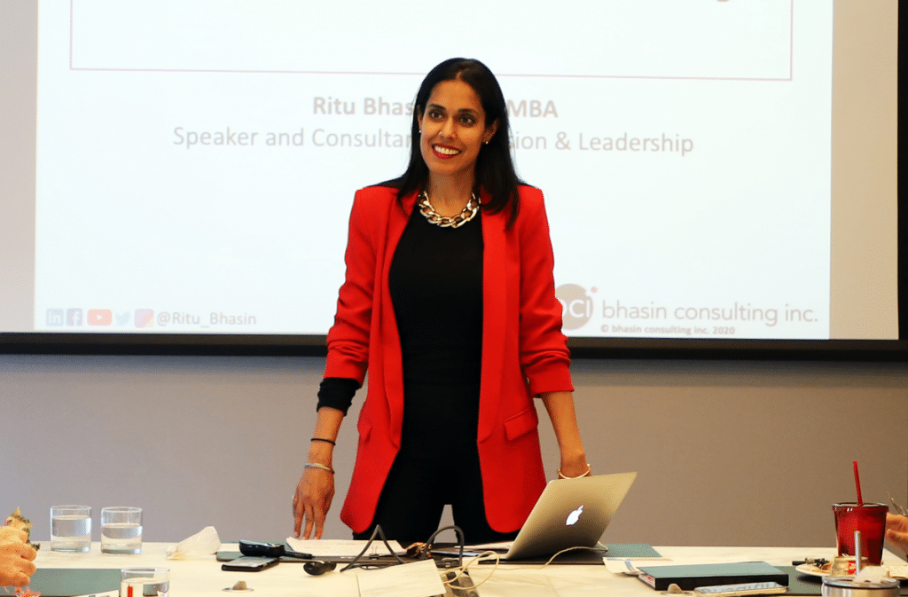 Ritu Bhasin presenting in a conference room