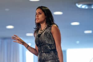 Ritu Bhasin speaking on a conference stage